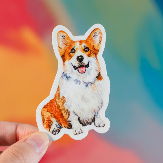 Sticker of a corgi dog held against a colorful blurred background