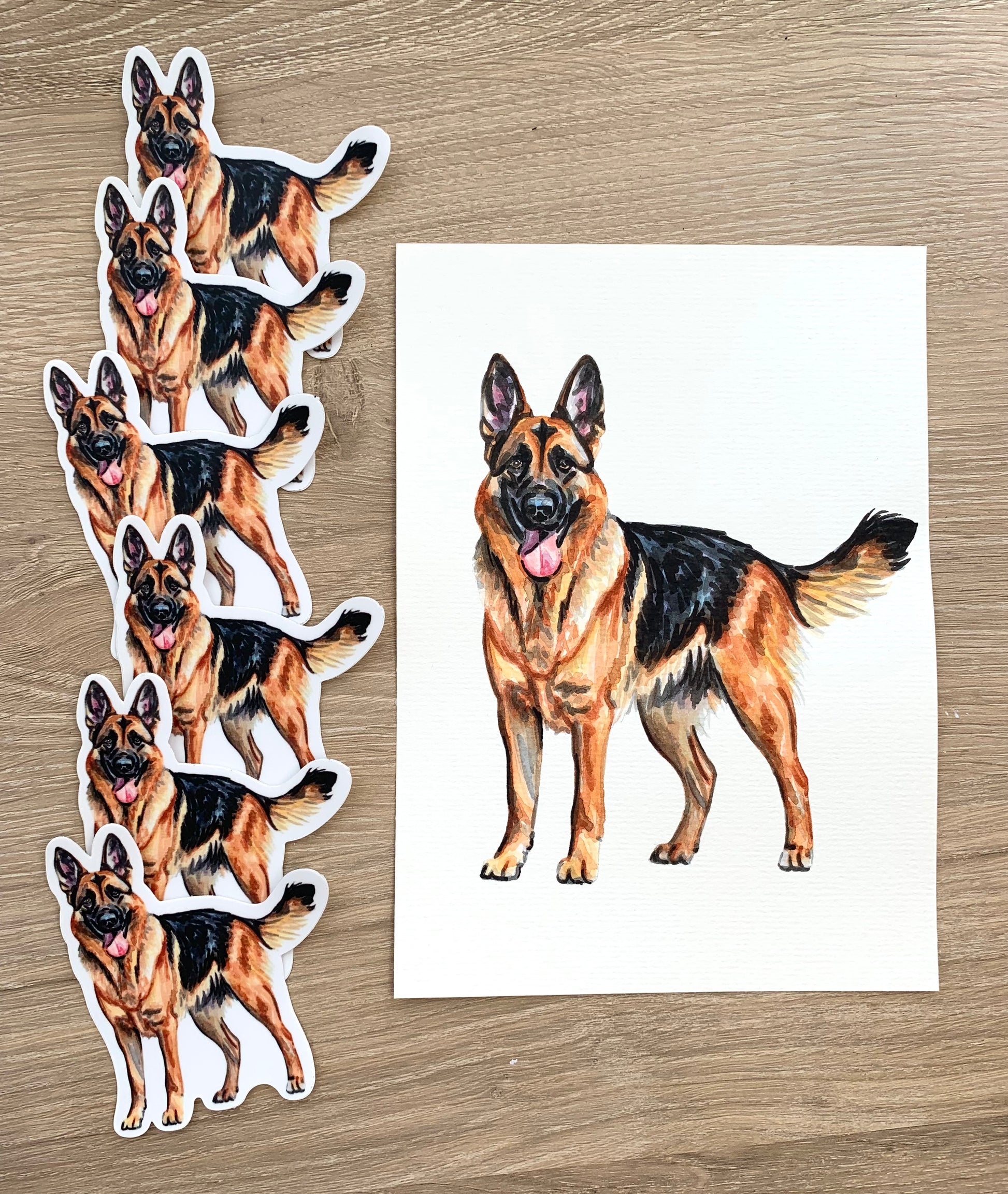 Set of German Shepherd stickers on a wooden surface with a matching pet portrait