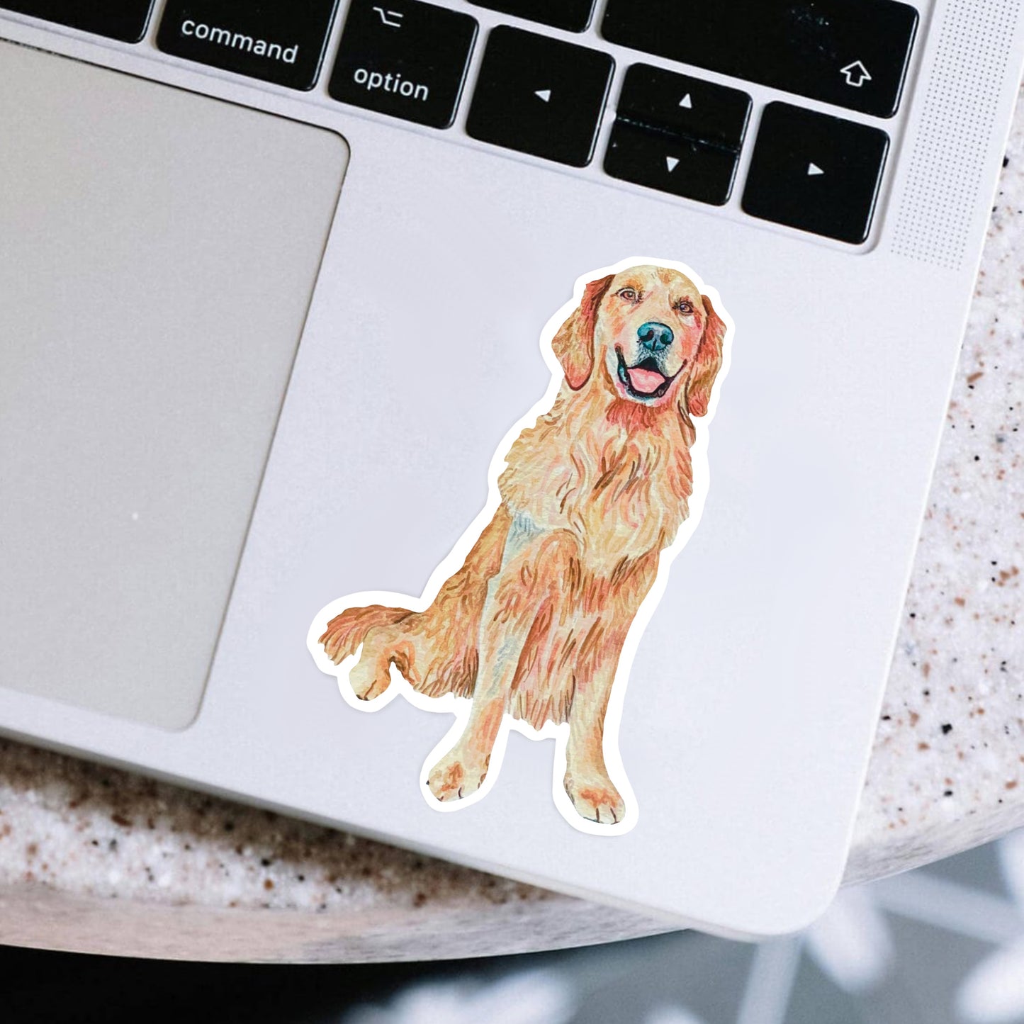 Golden retriever sticker on a laptop
