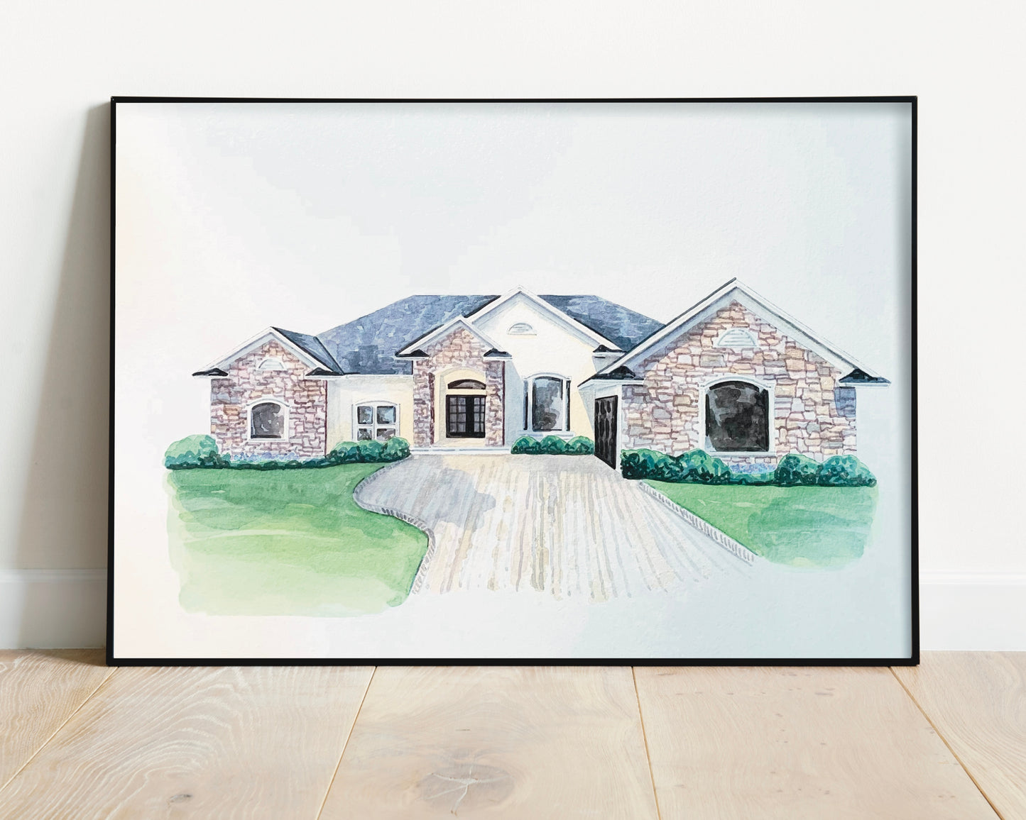 watercolor custom home painting in a black frame
