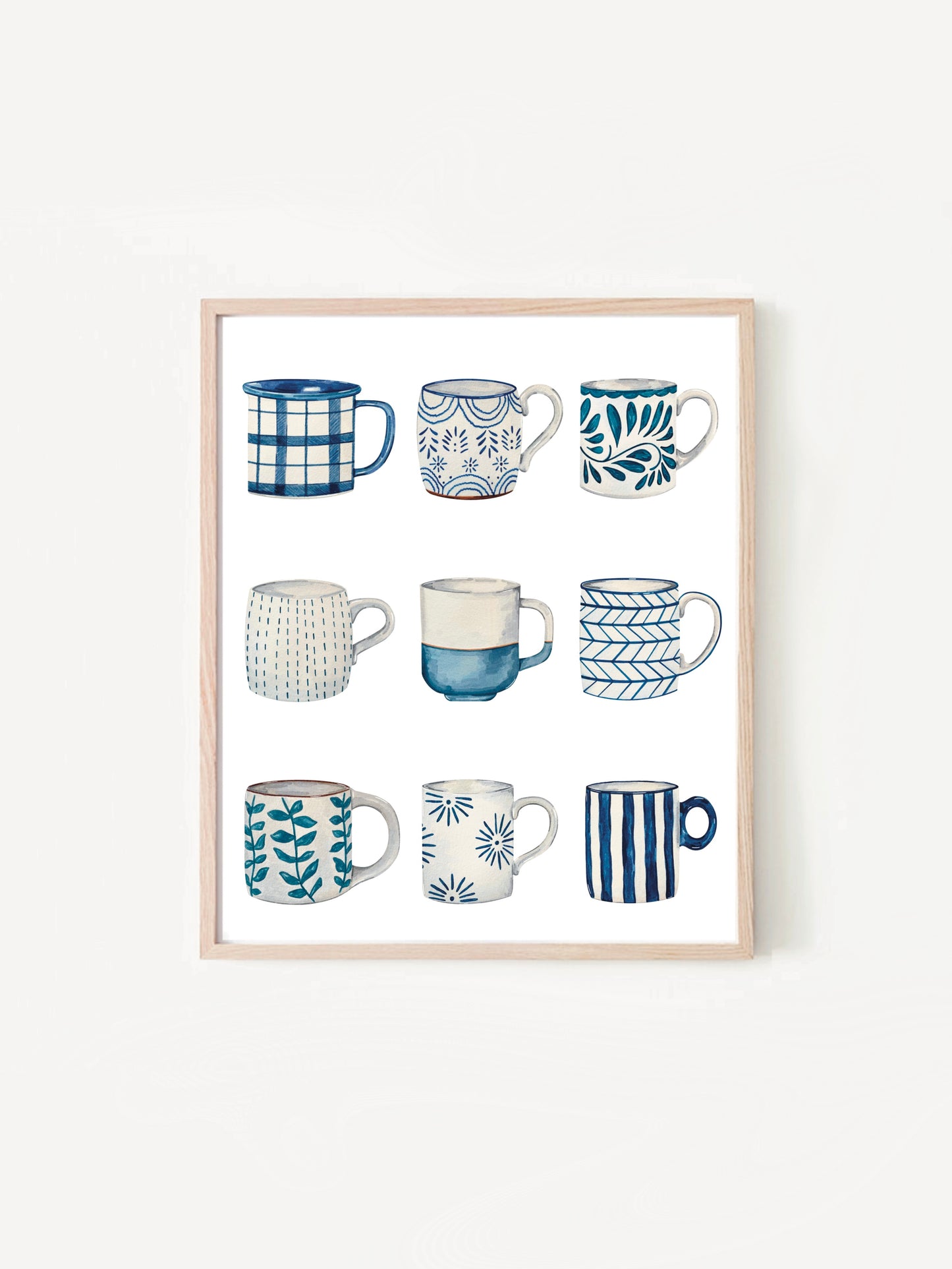 Framed artwork of various blue and white mugs on a white background