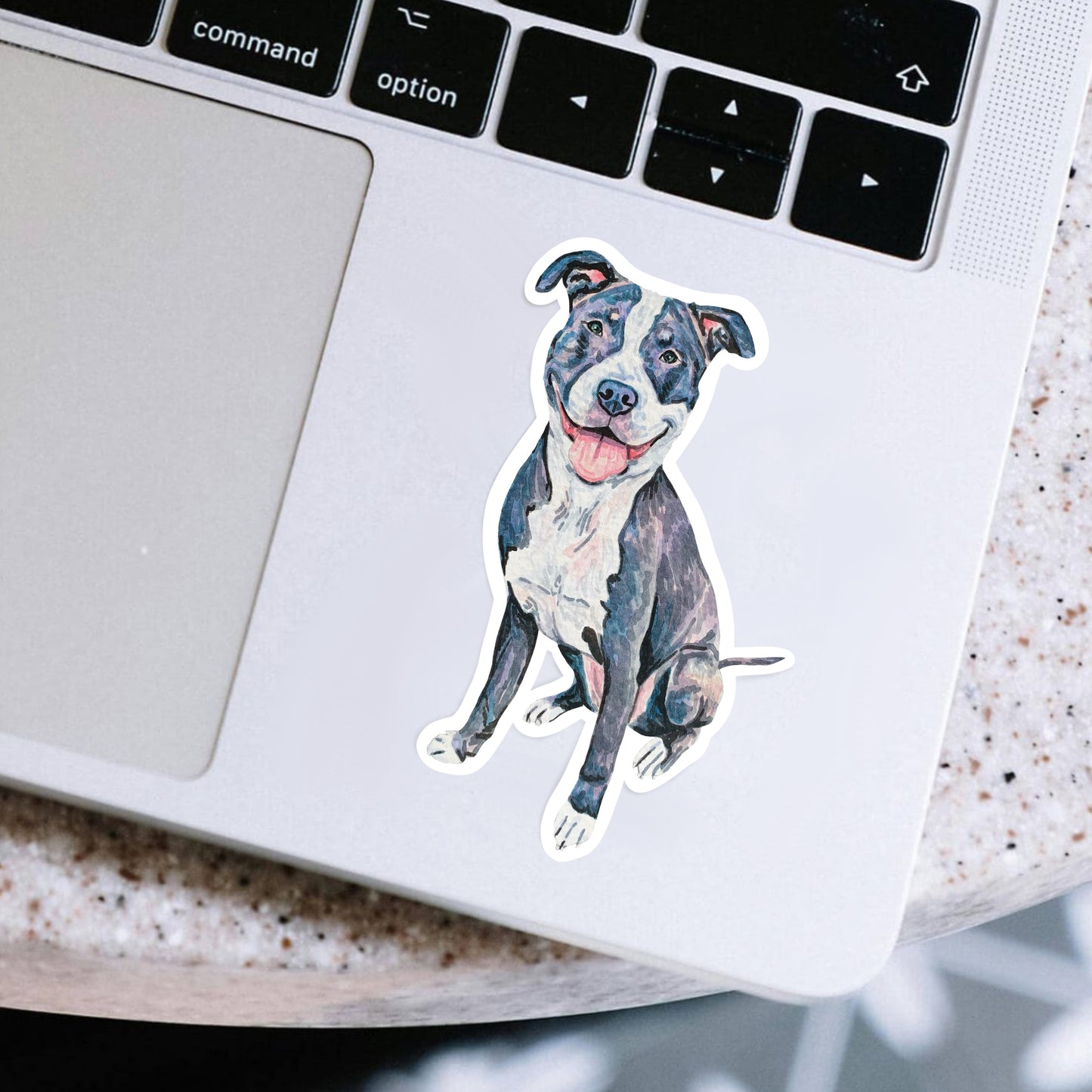 Sticker of a pit bull dog on a laptop 
