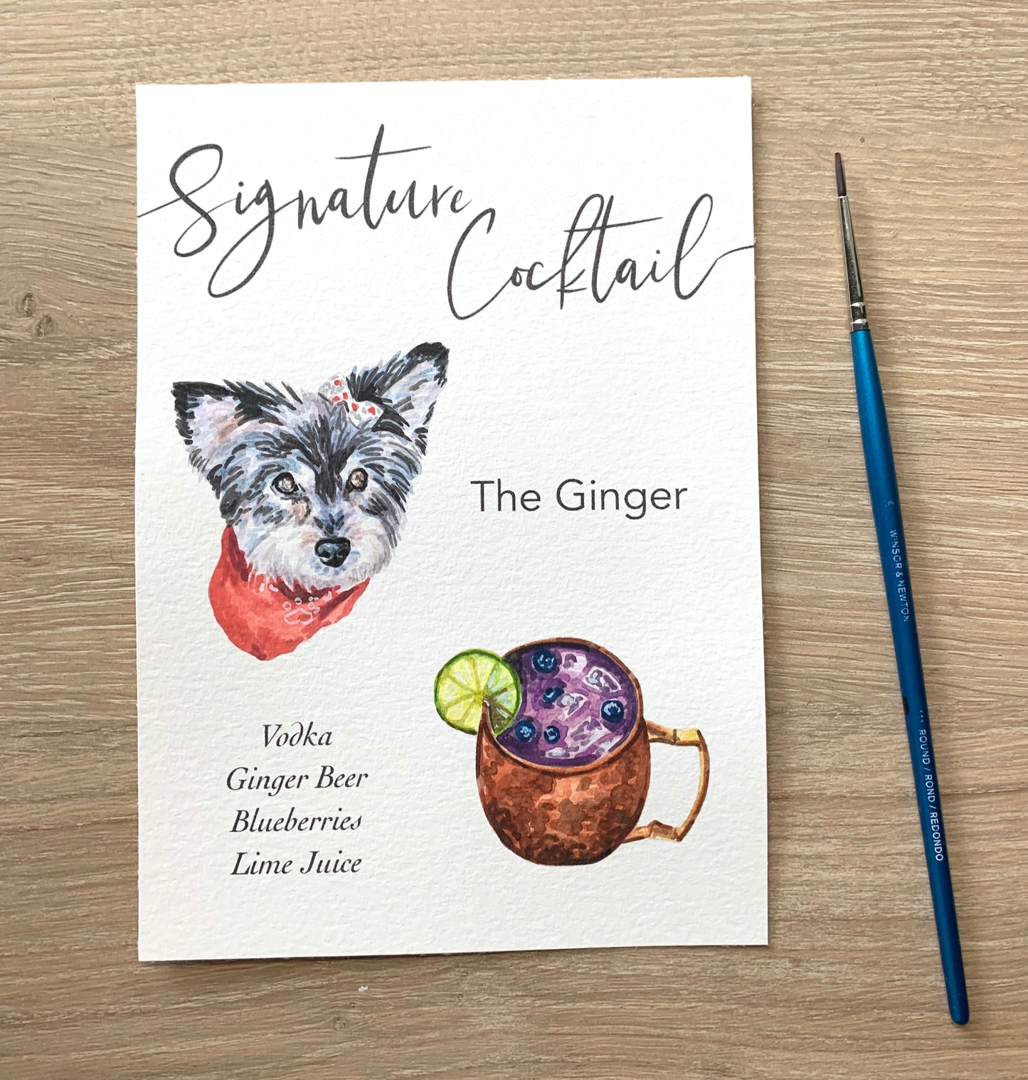 pet portrait signature cocktail sign next to a paint brush