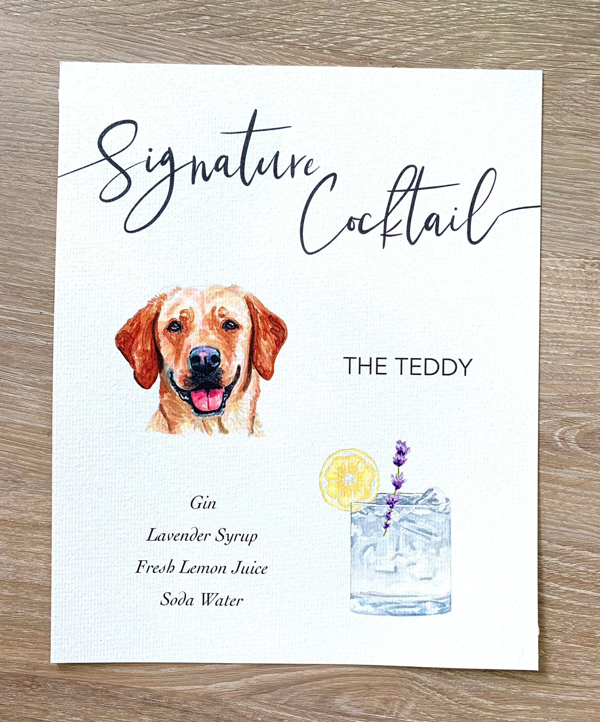 Signature cocktail sign with pet portrait on a wooden table