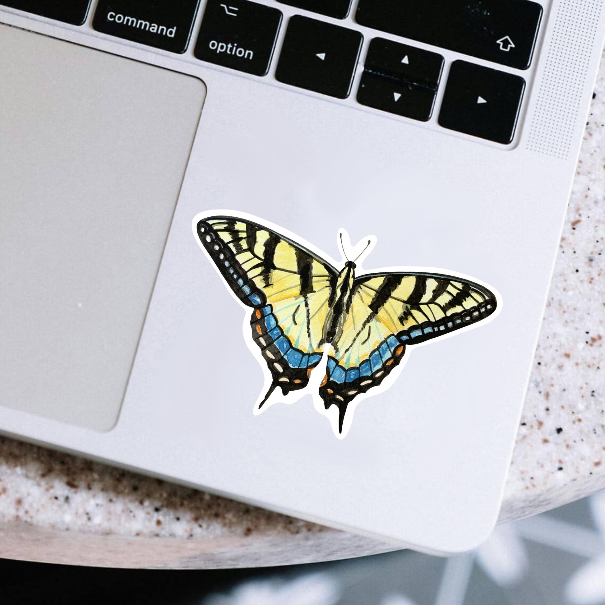 Tiger swallowtail butterfly sticker on a laptop