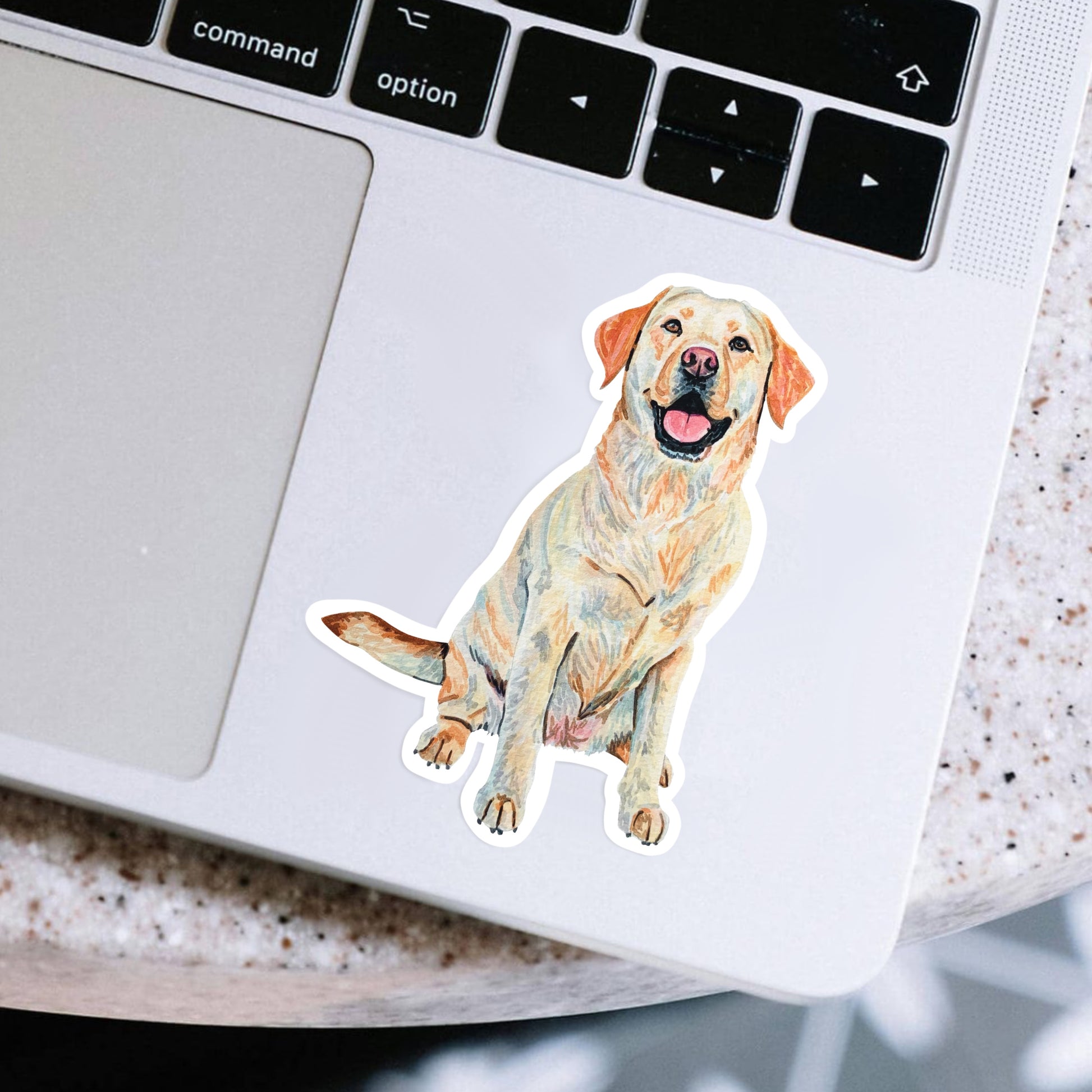 Yellow lab sticker on a laptop